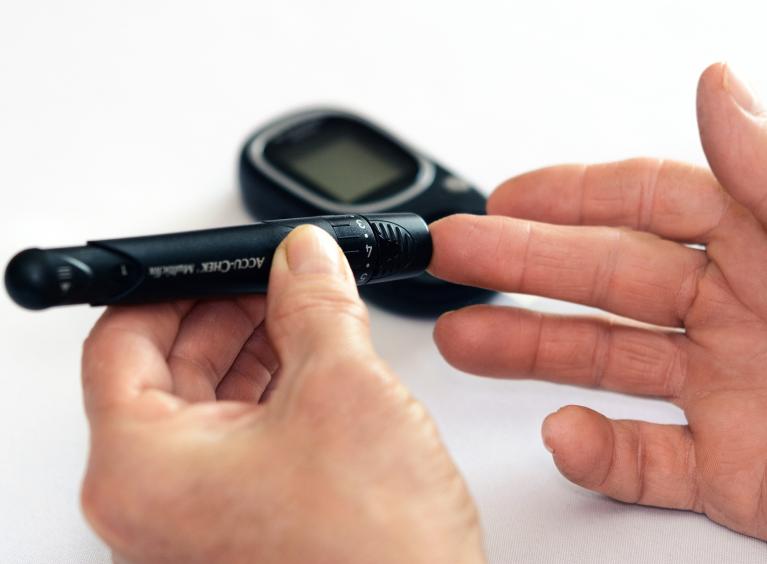 A person tests their blood sugar levels