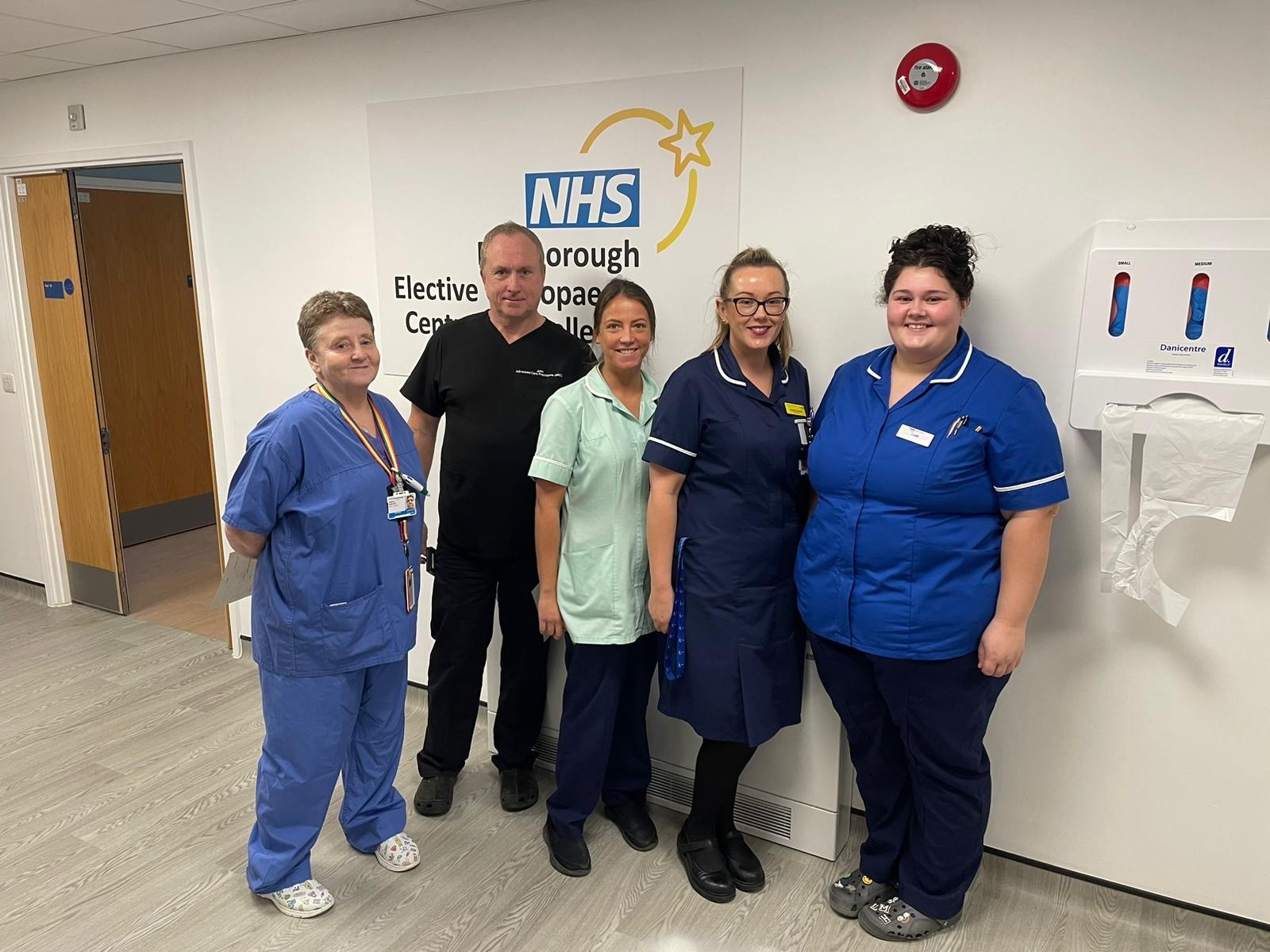 Photo of five members of hospital staff wearing uniforms