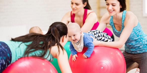 Mums and baby using gym equipment in an exercise class