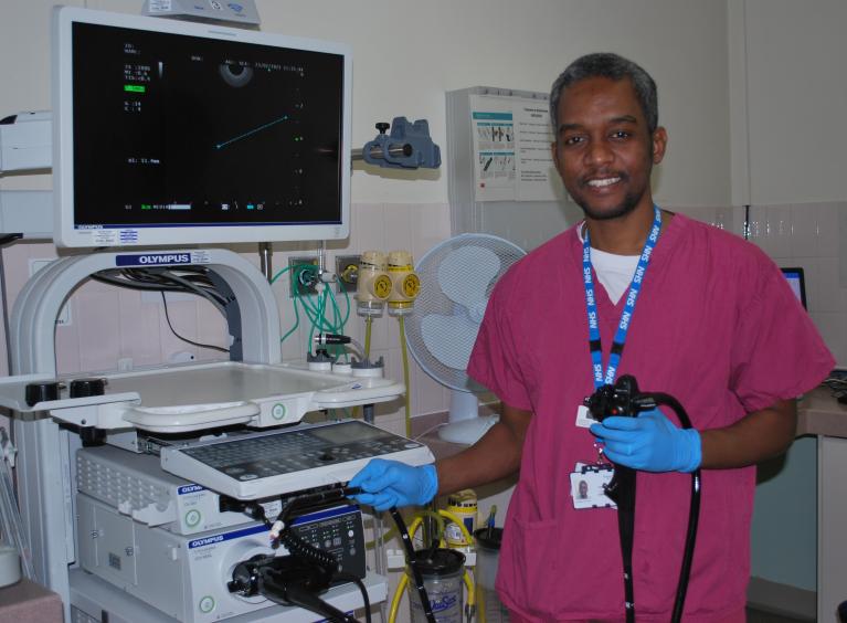 An endoscopist who works at Barnsley Hospital, showcasing a camera held on to a flexible tube called an endoscope.