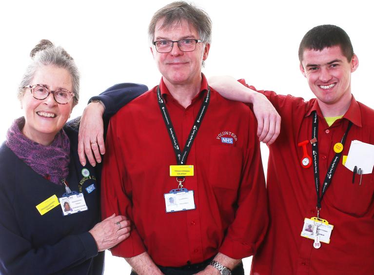 Three Barnsley Hospital volunteers smiling