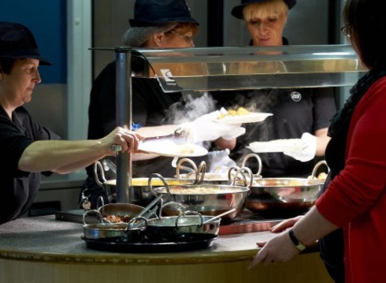 Staff serving customers at Collier's restaurant