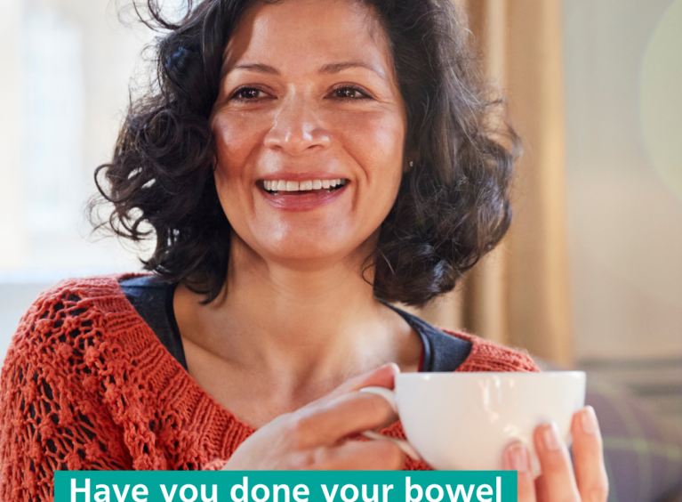 Woman having a cup of tea and asking if people have done their bowel cancer screening test