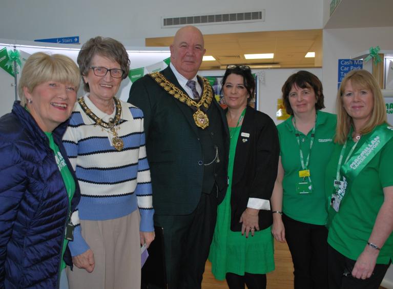 Mayor and mayoress with Macmillan workers at the new info pod