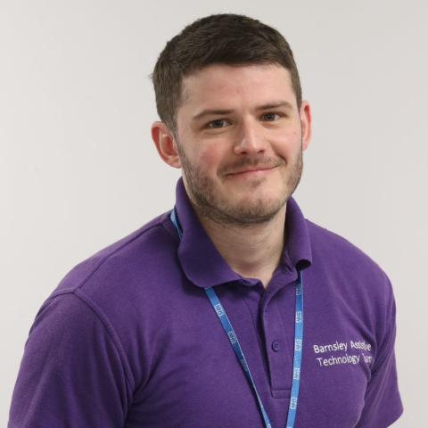 Healthcare scientist Brogan in purple T-shirt